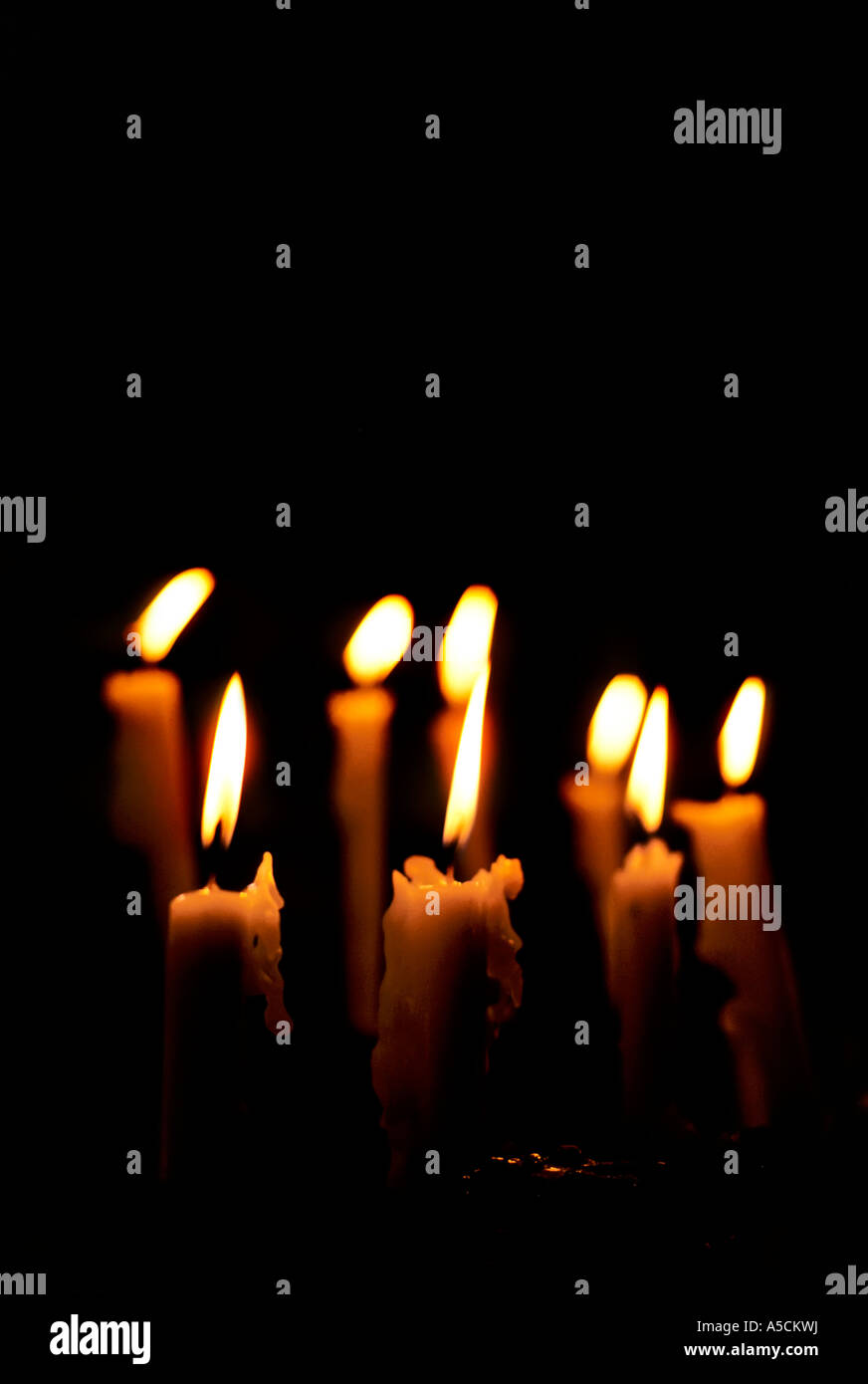 Church candles against black background Stock Photo Alamy