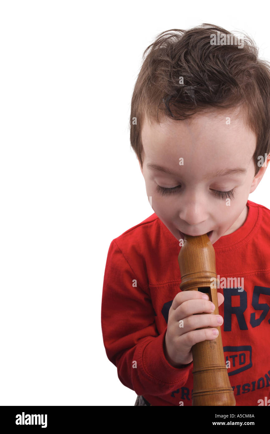 Little boy playing the flute Stock Photo