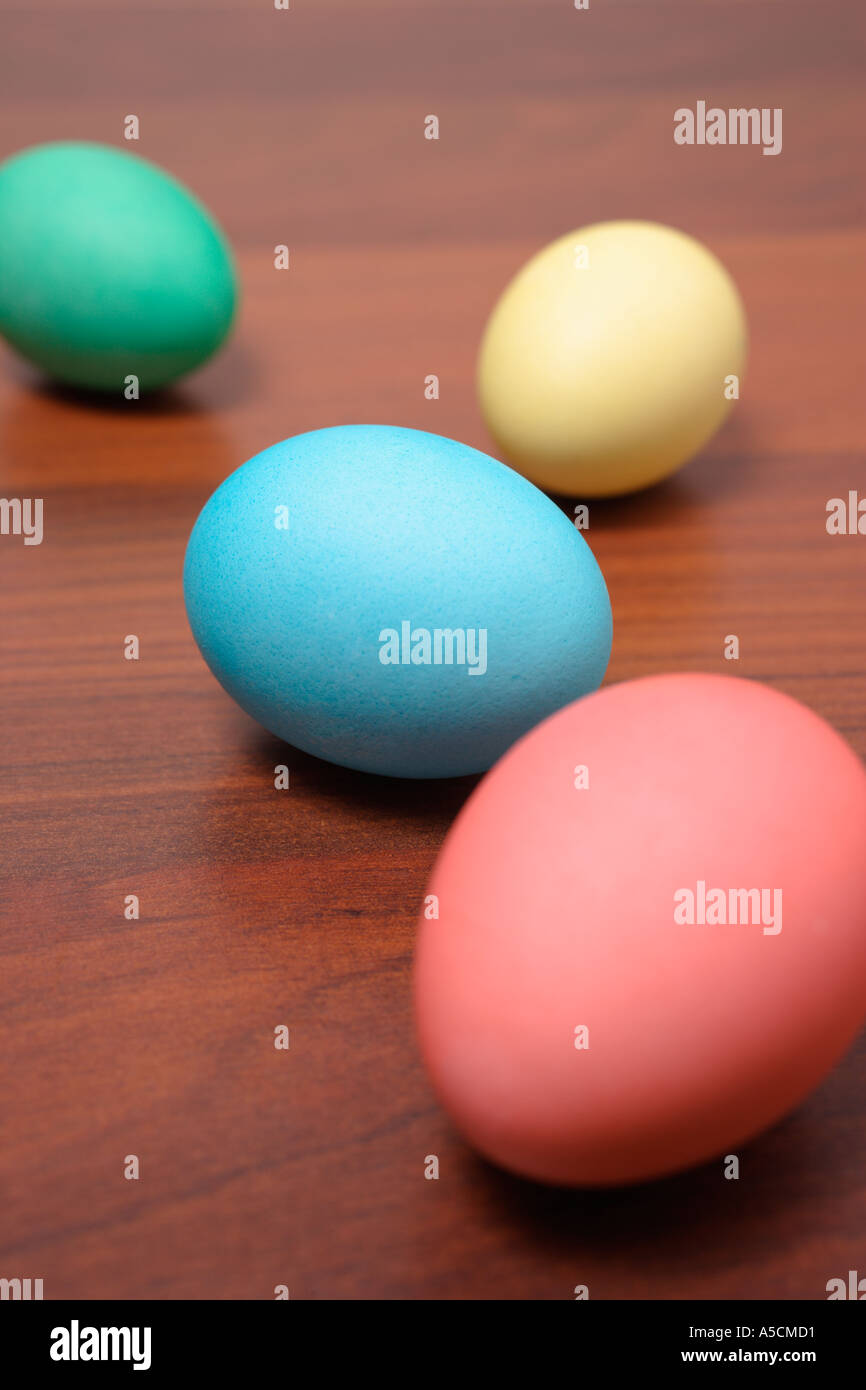 Easter Eggs in a Row on a wooden table Stock Photo