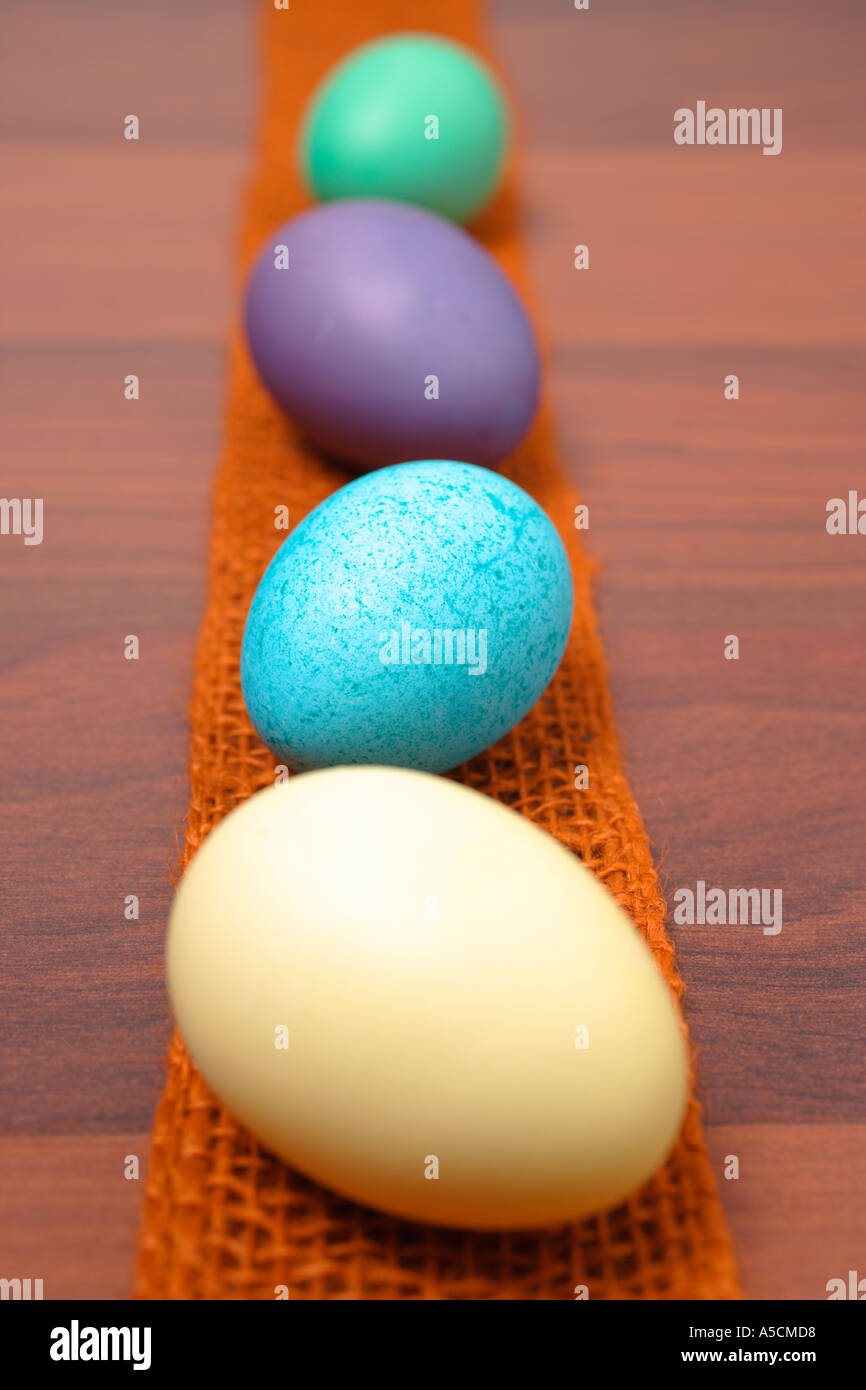 Easter Eggs in a Row on a wooden table Stock Photo