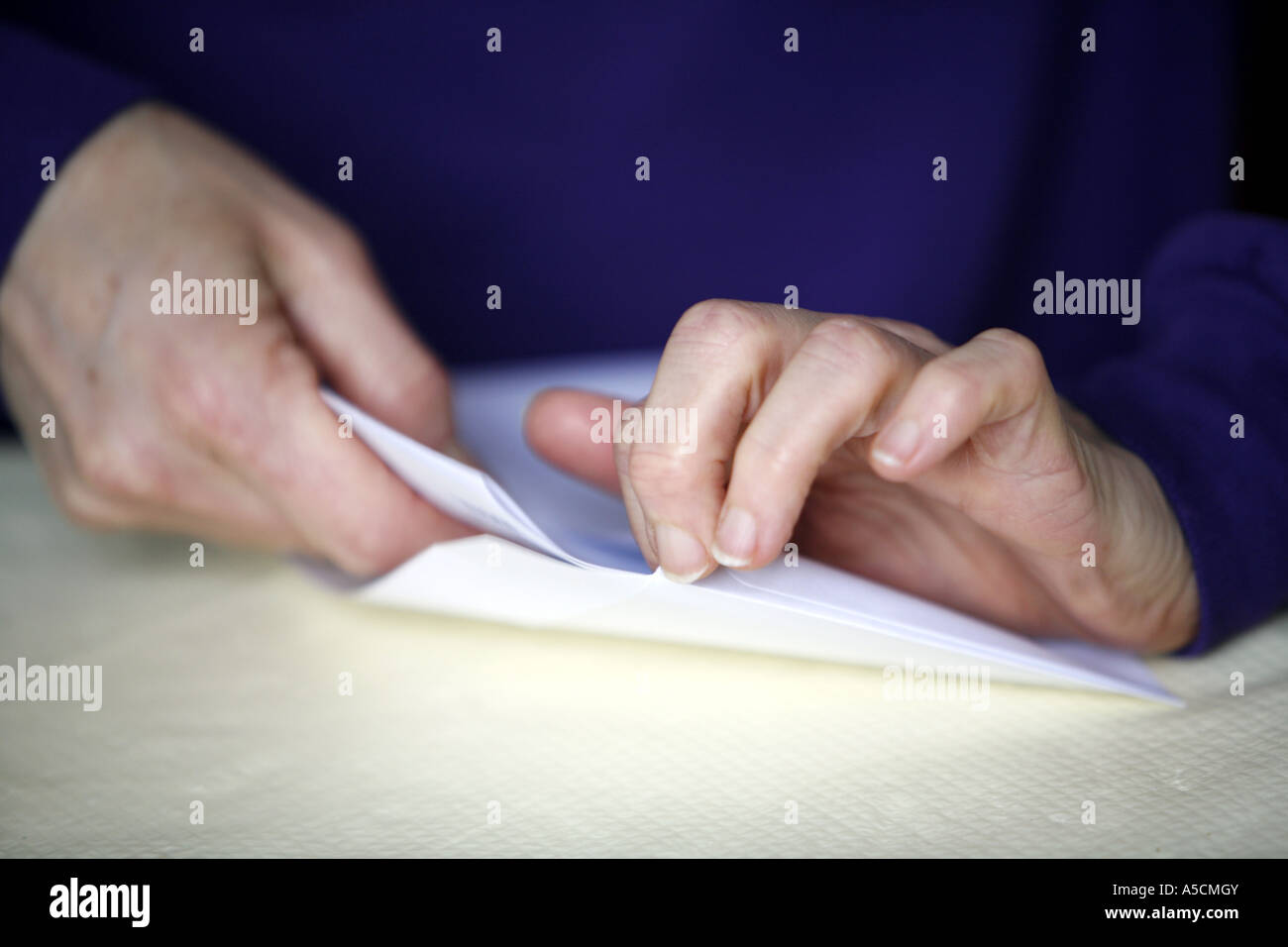 Hands stuffing envelopes Stock Photo Alamy