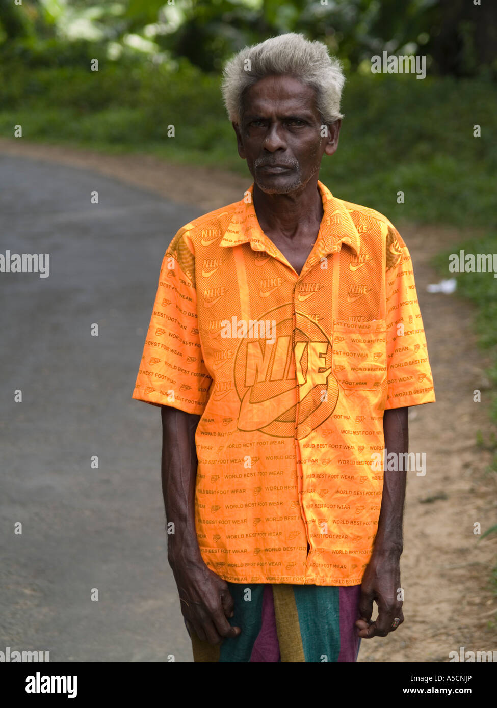 Sri Lankan Sarong Western shirt Stock Photo - Alamy