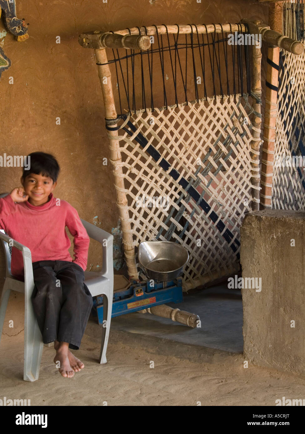 A Man Sits On A Chair Supported By A Rope Patio Doors Plastic High Resolution Stock Photography and Images - Alamy