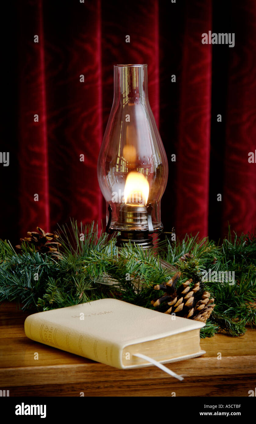 Oil lamp and Bible in church setting Stock Photo Alamy