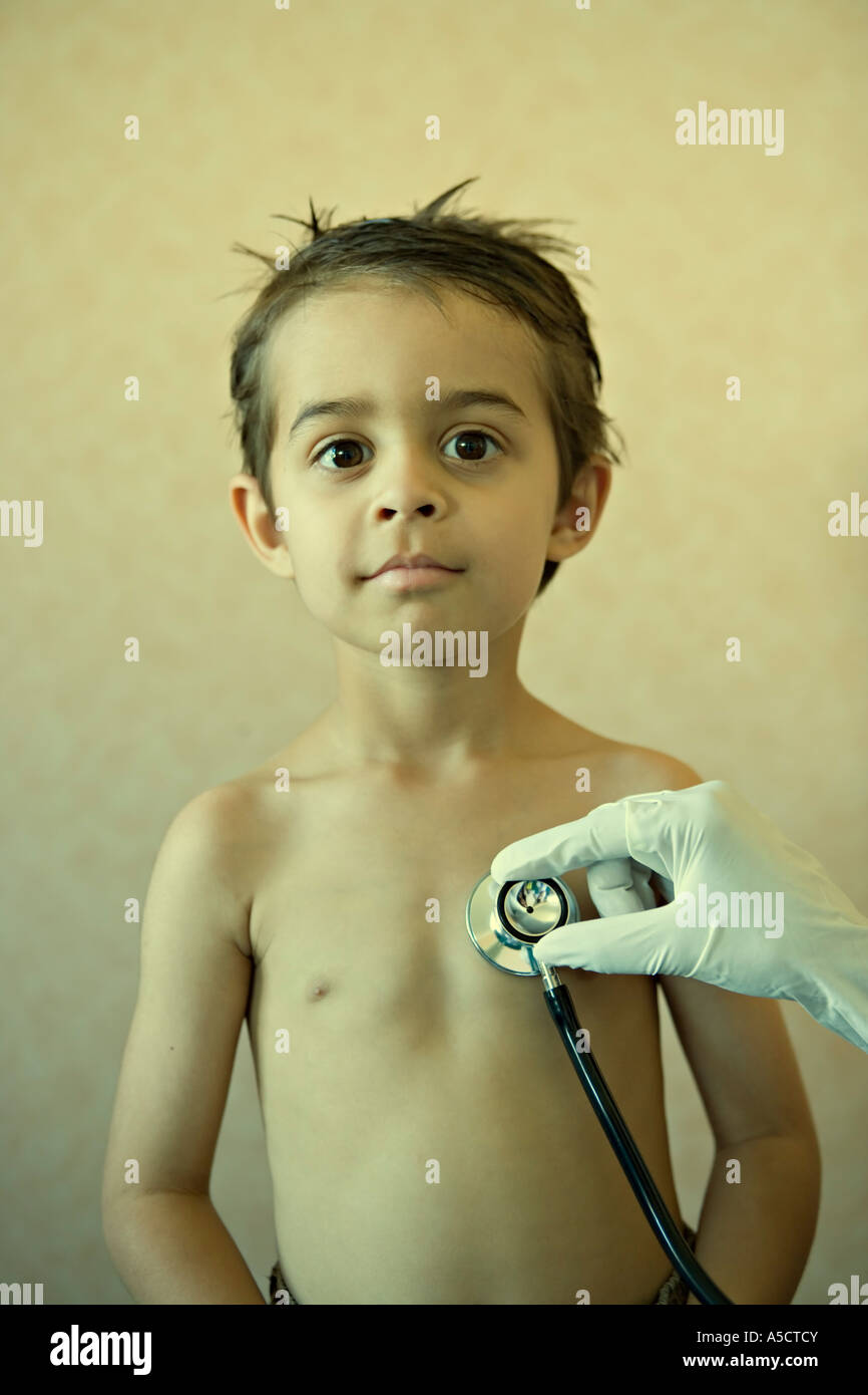 Boy undergoes medical healthcare examination with stethoscope Stock Photo