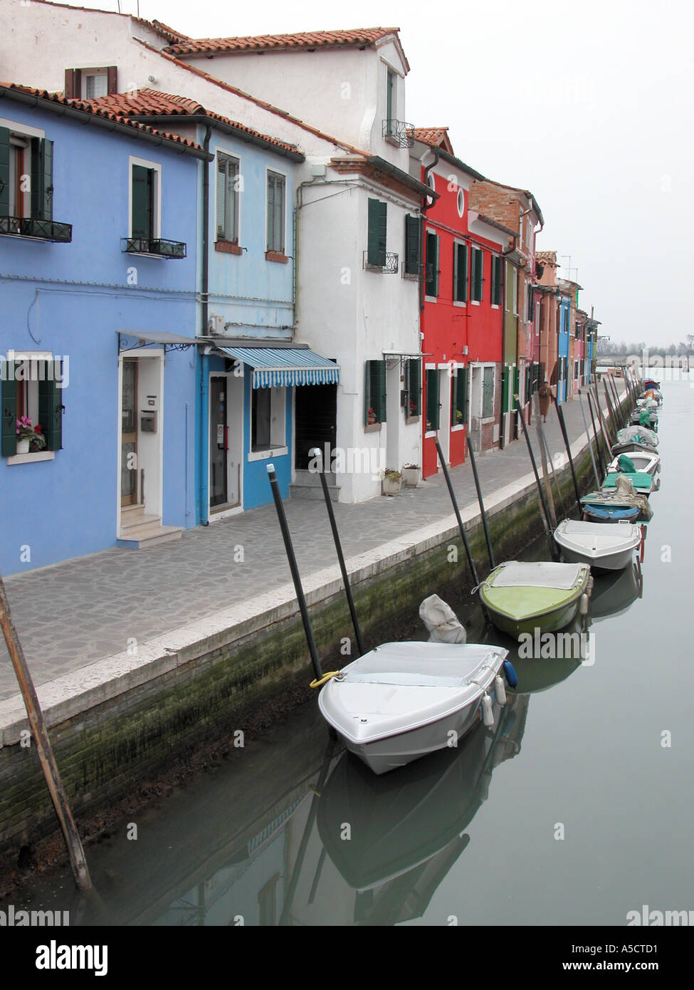 Colourful bright multihued residential houses along canals of Burano Island Venice Venezia Veneto Italy Europe EU Mediterranean Stock Photo