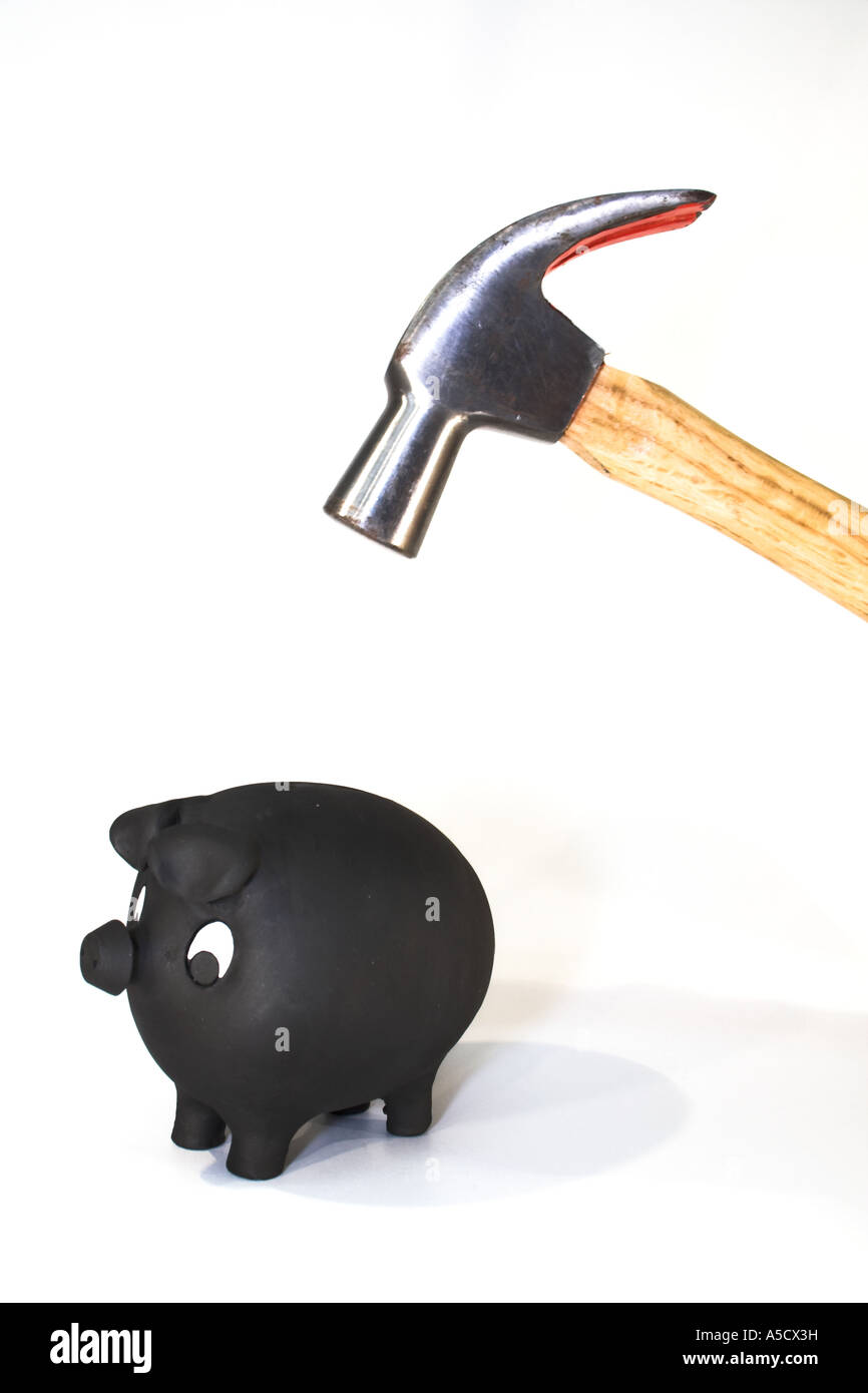 Piggy bank with hammer about to smash it Stock Photo Alamy
