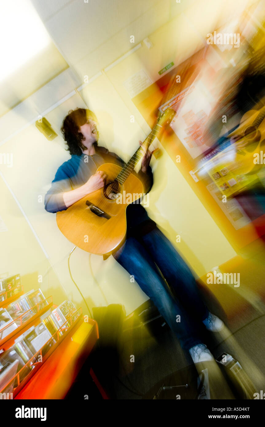 euros childs guitarist ex Gorky's Zygotic Mynci performing informal acoustic gig in andy's records record shop aberystwyth wales Stock Photo