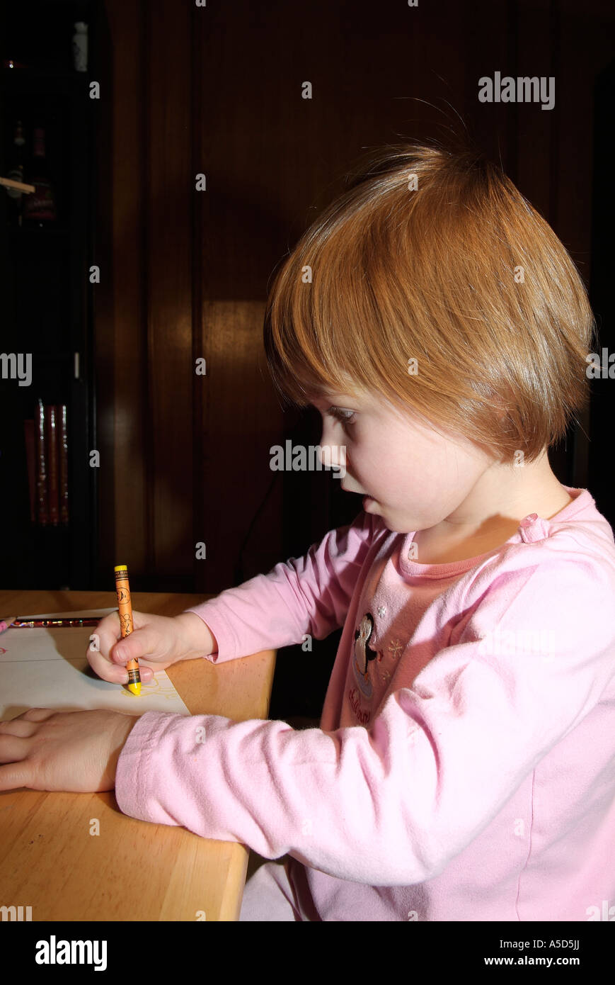 Young girl drawing on paper Stock Photo - Alamy