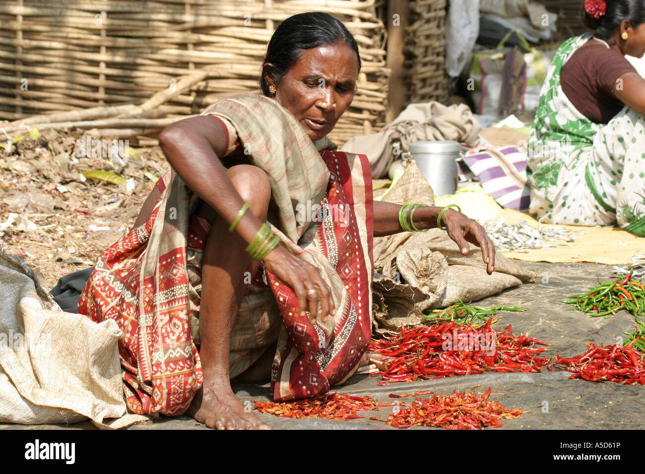 Woman selling chillies hi-res stock photography and images - Alamy