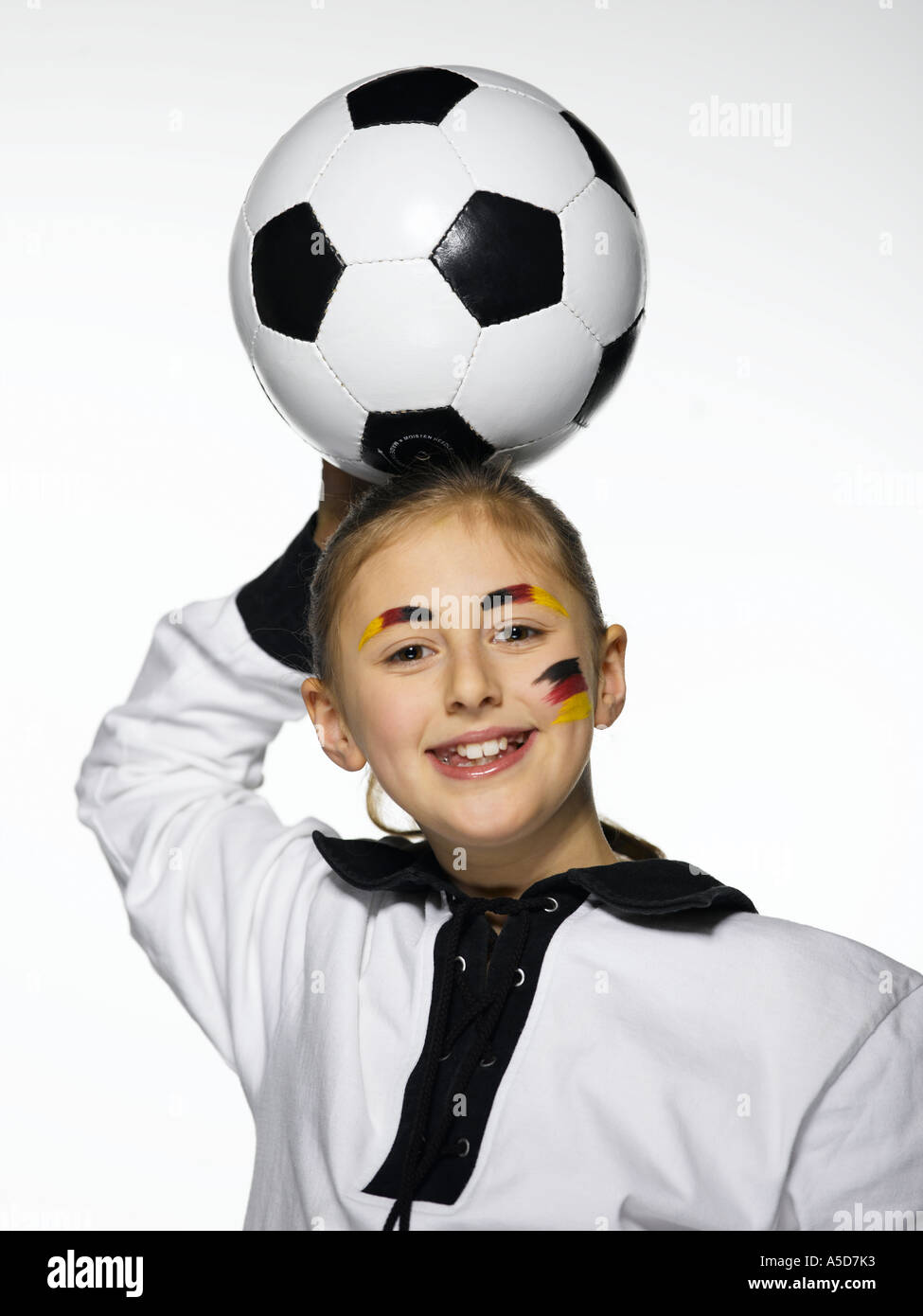 Girl, German football fan, holding football Stock Photo Alamy