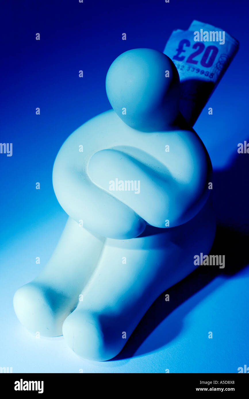 Pregnant mother sculpture money box with cash sticking out of the coin slot Stock Photo