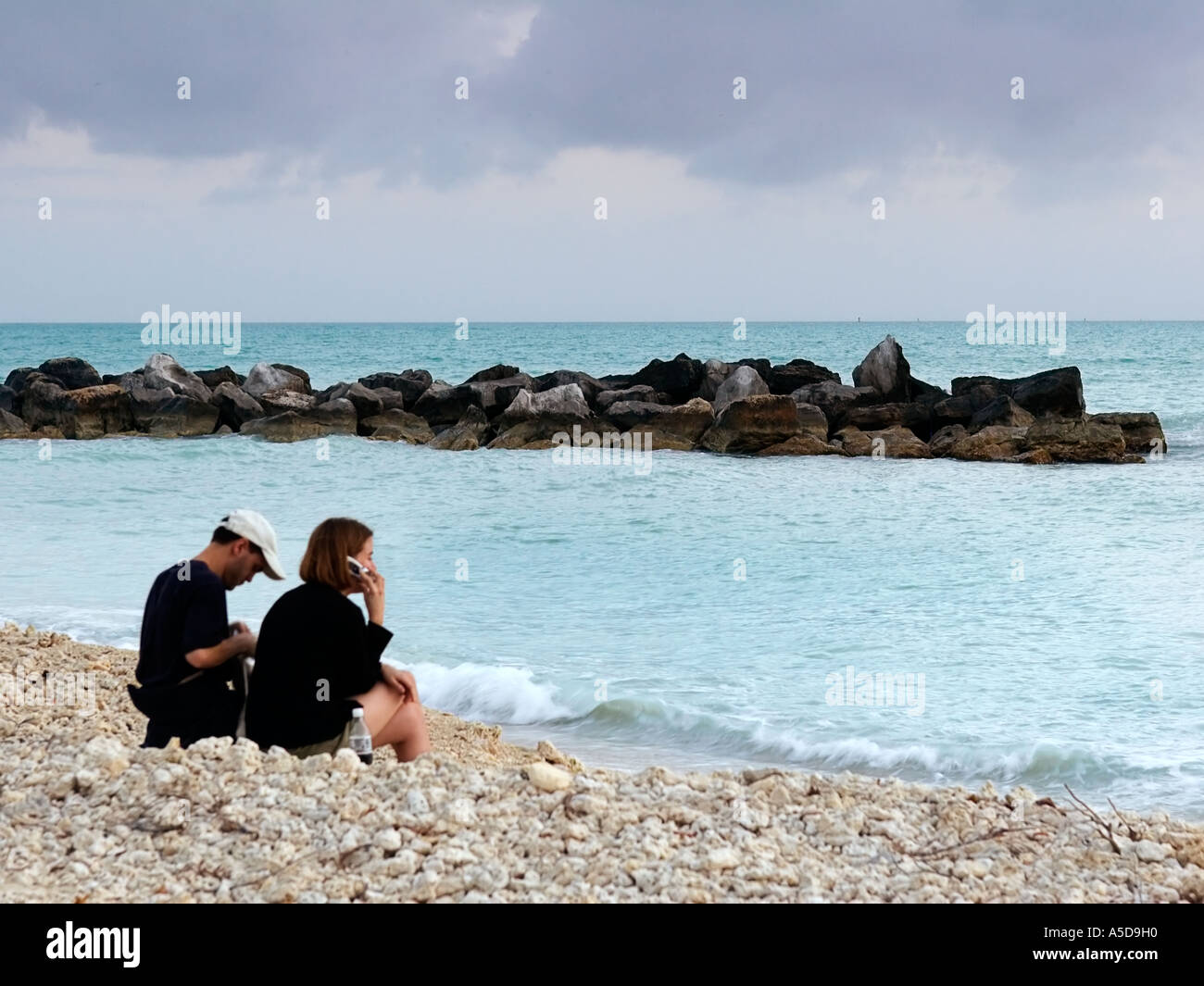 A couple talking on a cell phone Stock Photo