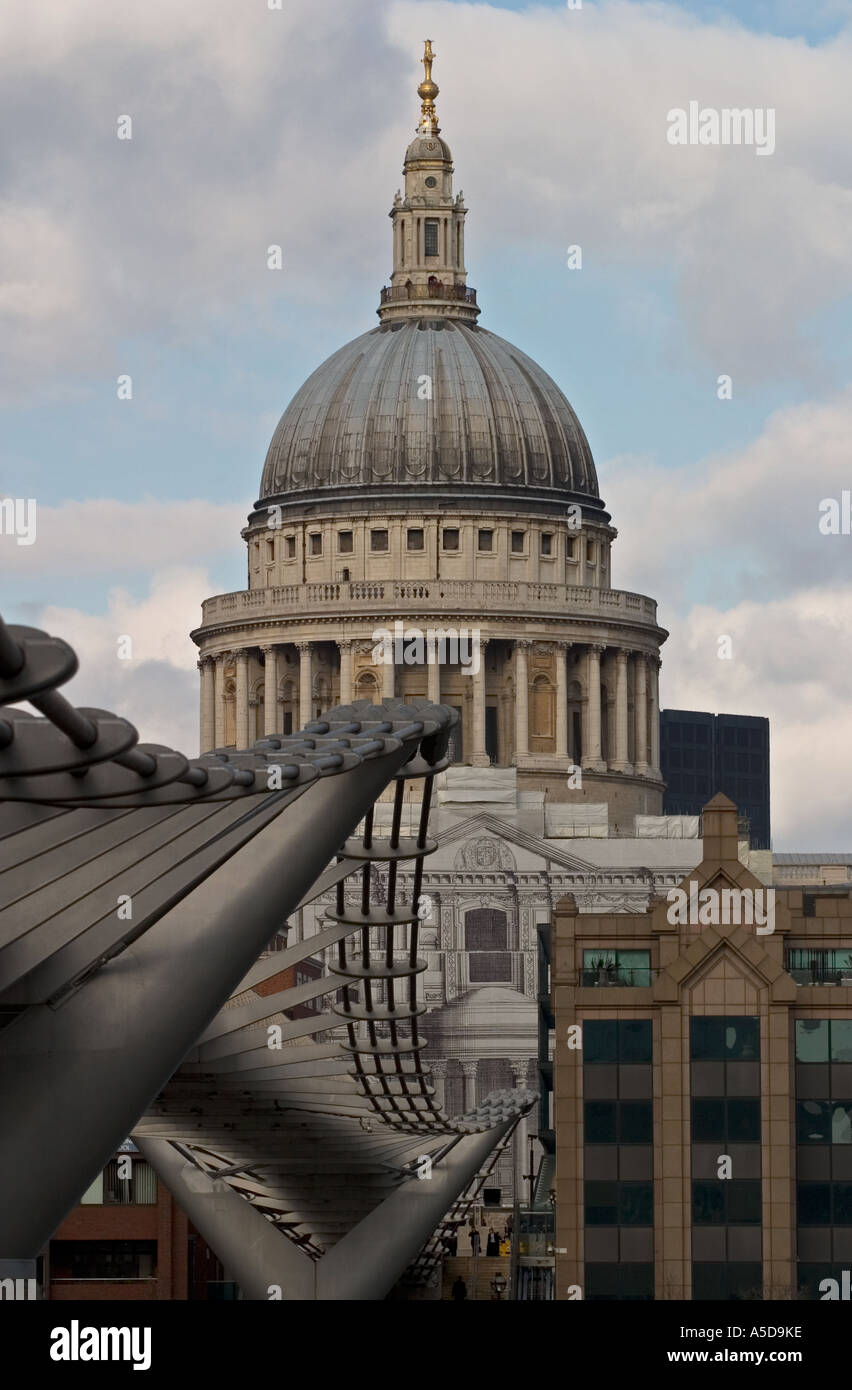 St Pauls Cathedral one of London top tourist attractions viewed from the South Bank with the Millennium Bridge in the foreground Stock Photo