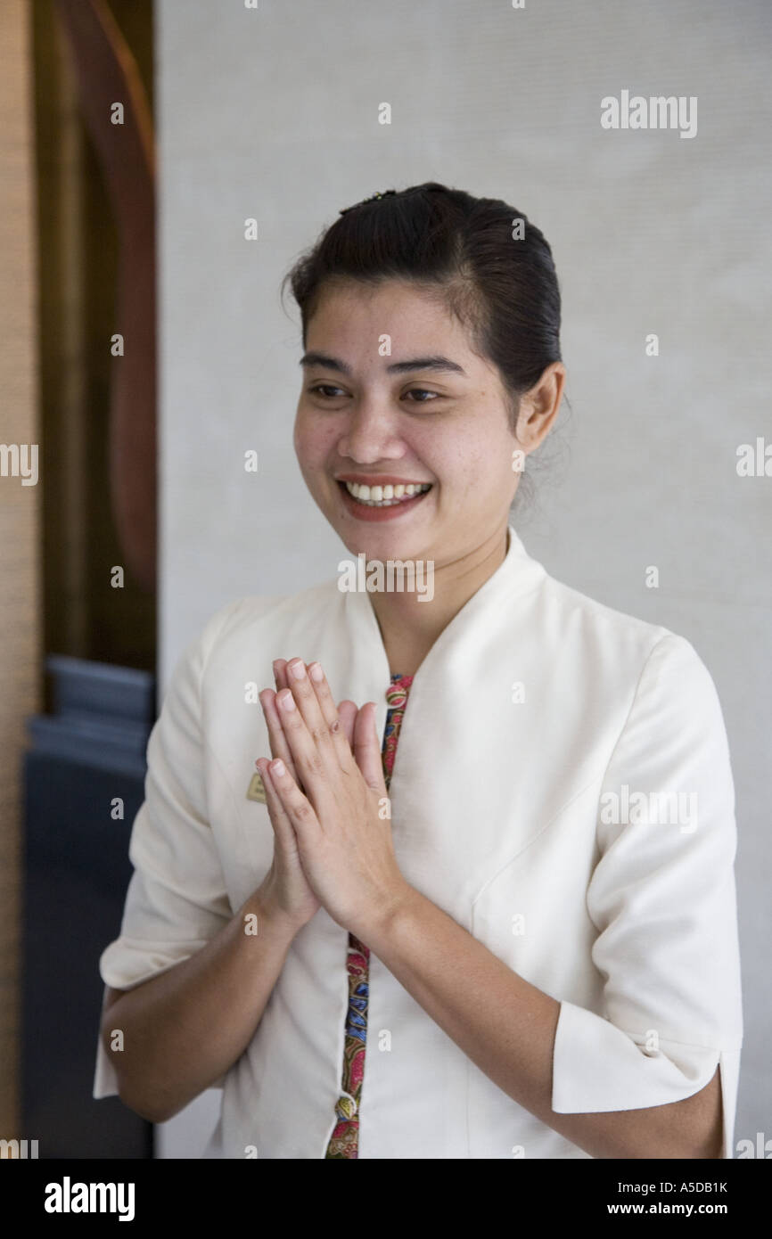 Female hotel worker at Five Star hotel posing in interior with
