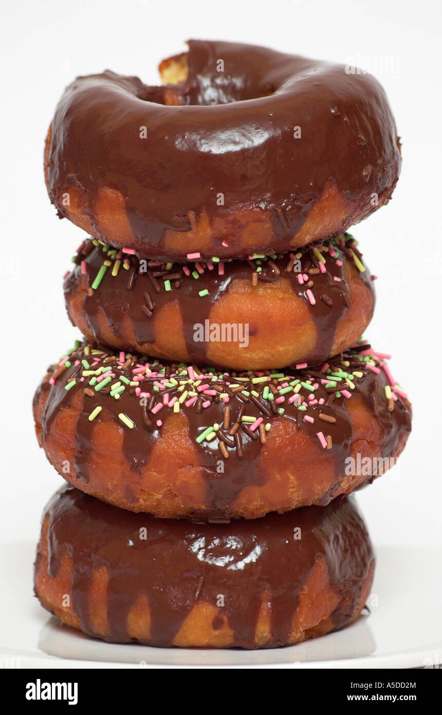 Stack of chocolate doughnuts with sprinkles close up Stock Photo - Alamy