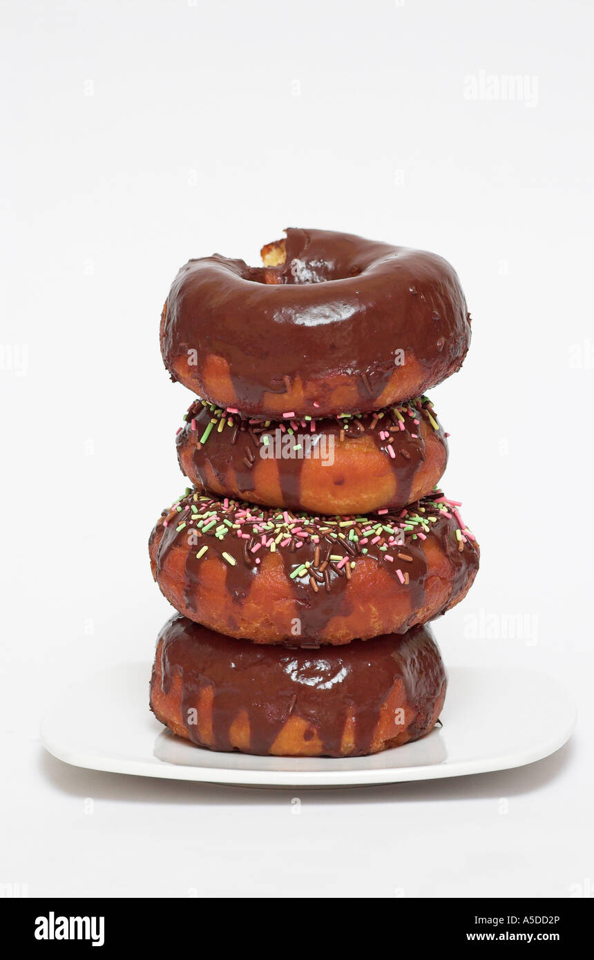 Stack of chocolate doughnuts with sprinkles close up Stock Photo - Alamy