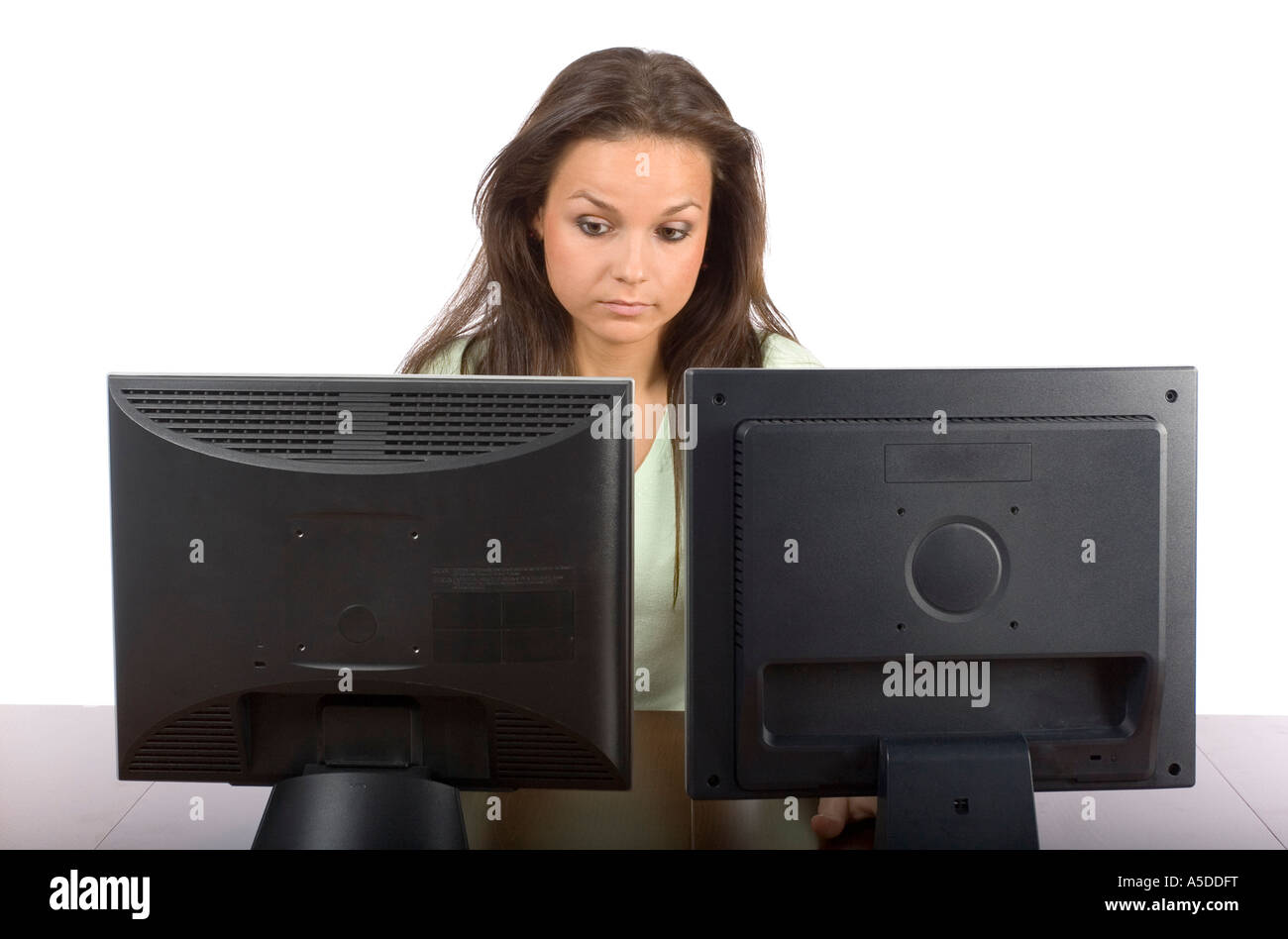 Two people looking at computer screens hi-res stock photography and ...