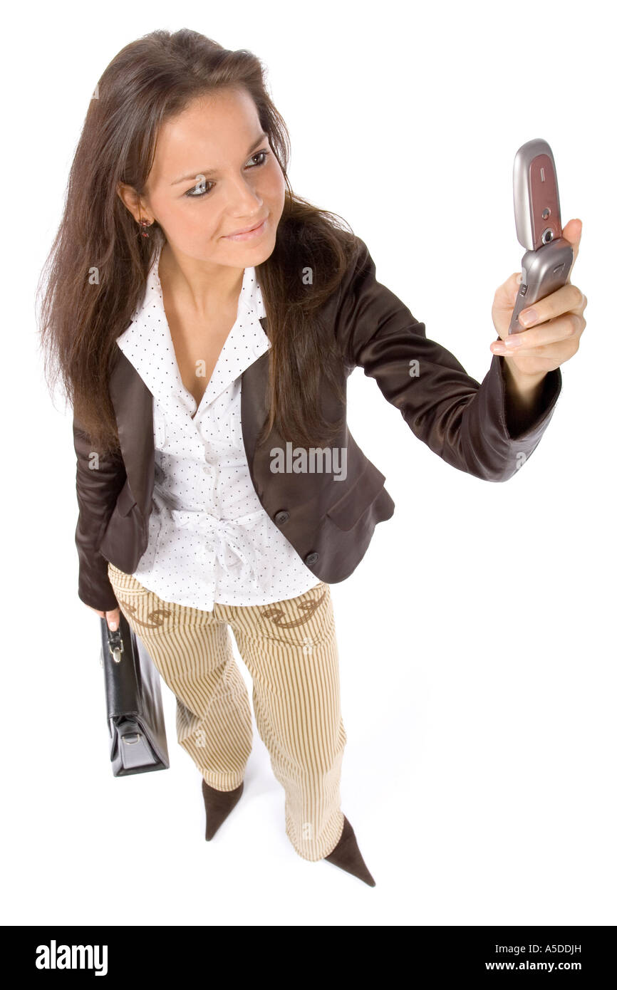 standing woman with suitcase and mobile headshot white background Stock Photo
