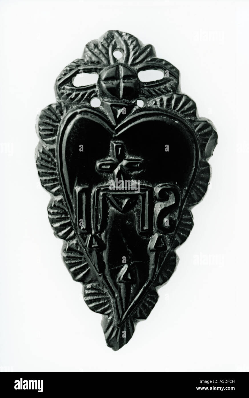 Sacred heart venera with crucifix motif Stock Photo