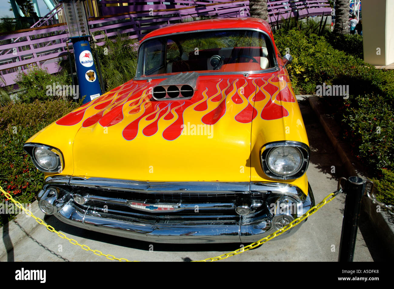 Closeup of classic American vehicle with exposed carburetor and custom