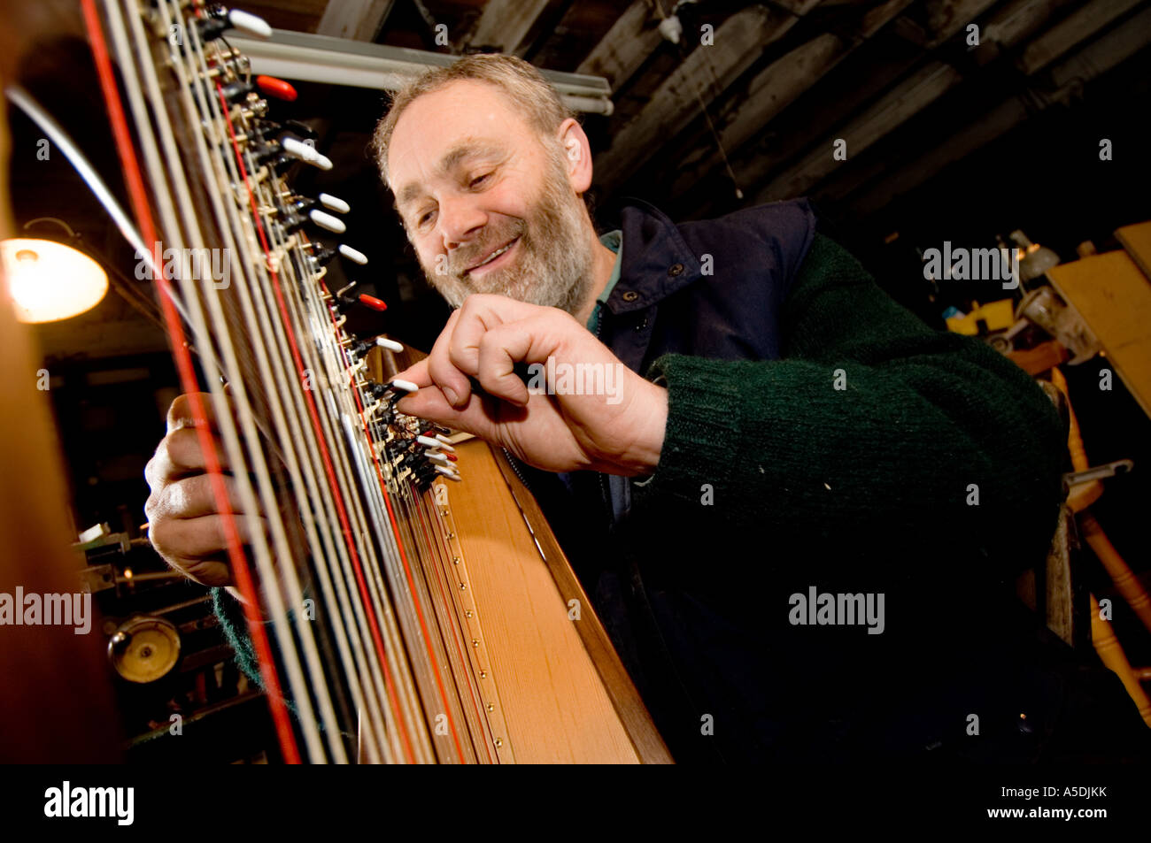 allan shiers harp maker in his tuning a new harp, Telynau
