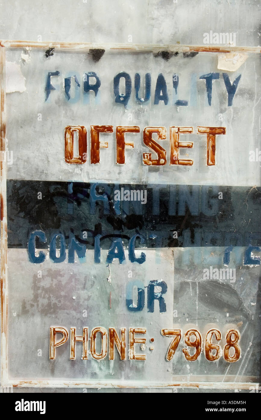 Faded old window sign, offset litho and typsetting, Kolkata, India Stock Photo