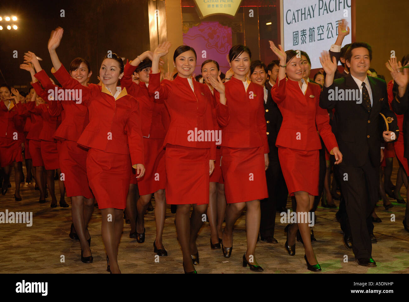 Cathay Pacific flight attendants taking part in the Hong Kong Chinese New Year Parade in China Stock Photo