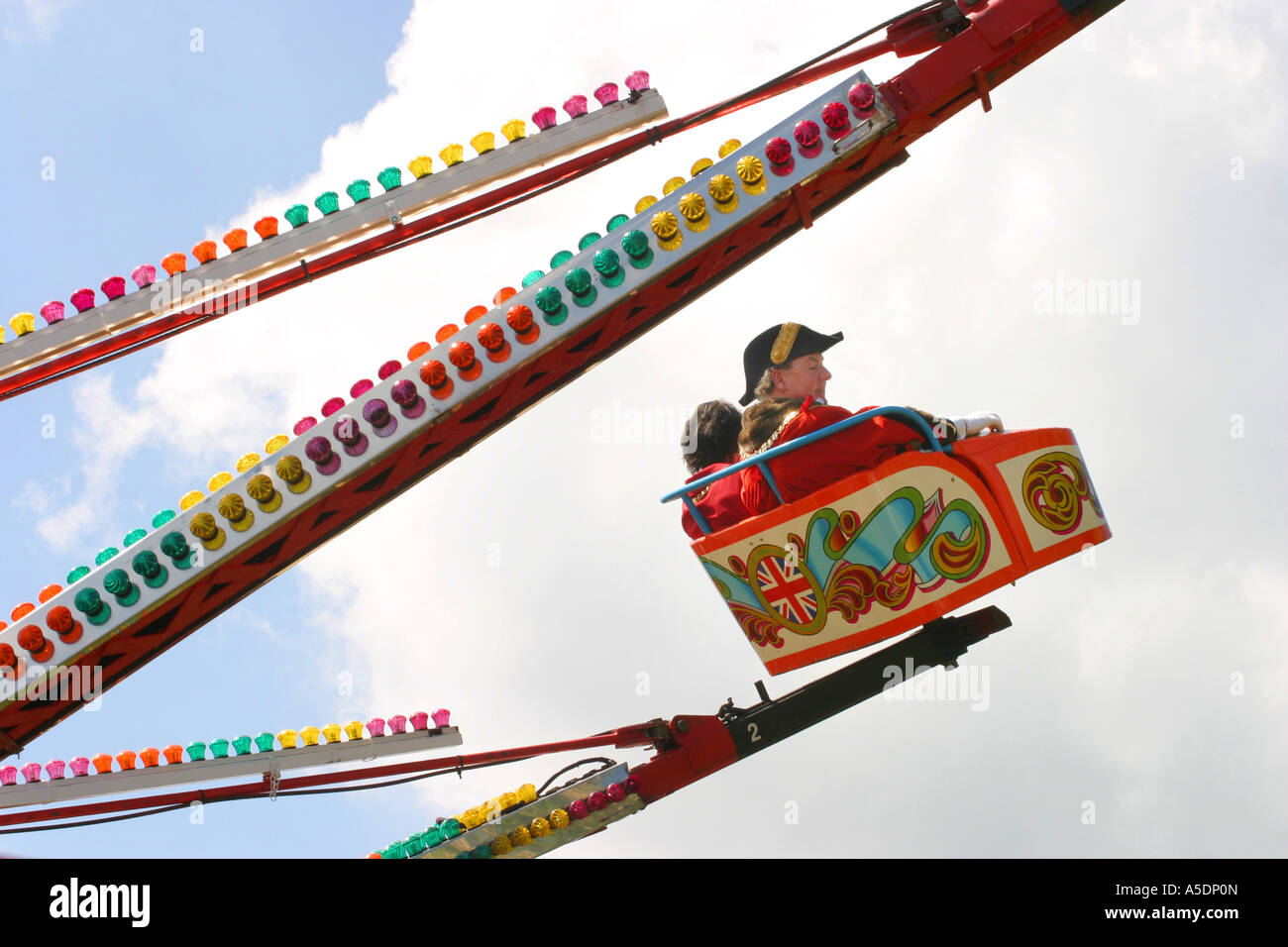 The Mayor and his wife ride the fairground ride, Reach Fair, Cambridge ...