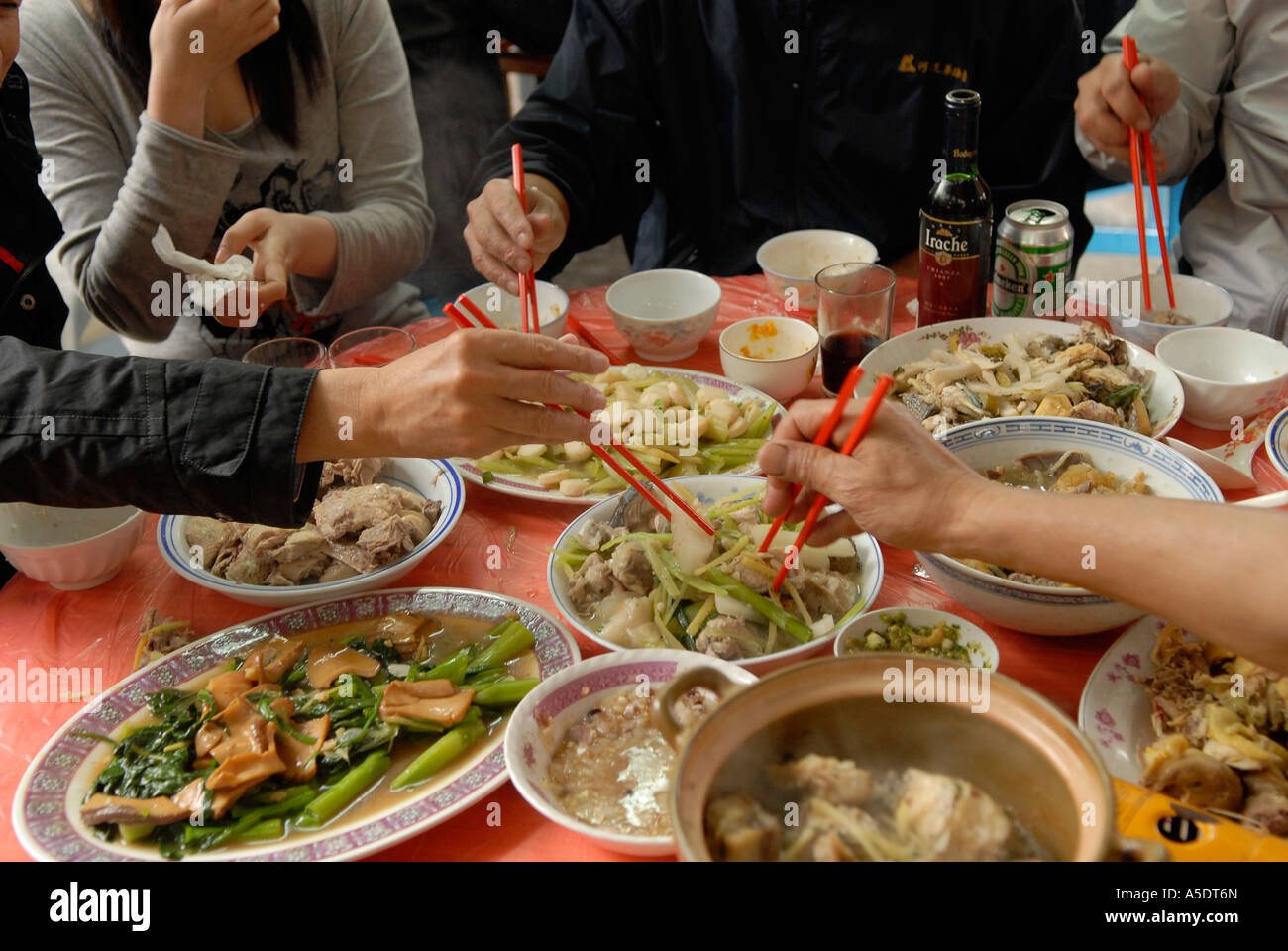 Local people eating traditional chinese food in Hong Kong China Stock