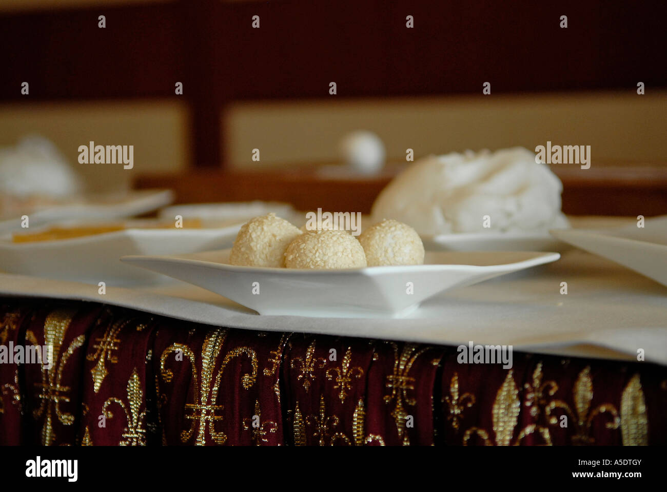 preparation of Dim sum sesame balls with glutinous rice flour and red bean paste; Also known as Jian Dui in Chinese. Hong Kong China Stock Photo