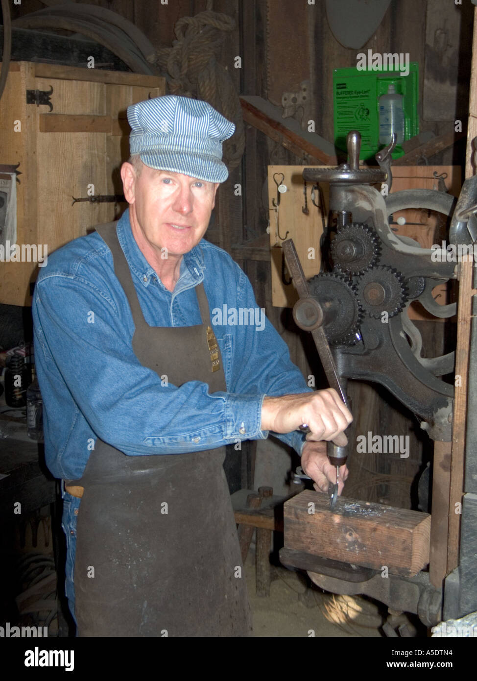 iron worker craftsman demonstrates old tools  from the California Gold Rush Stock Photo