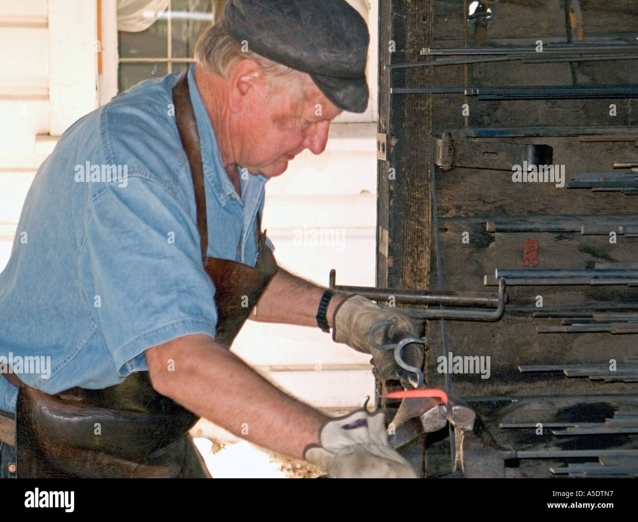 iron worker craftsman  demonstrates old tools  from the California Gold Rush Stock Photo