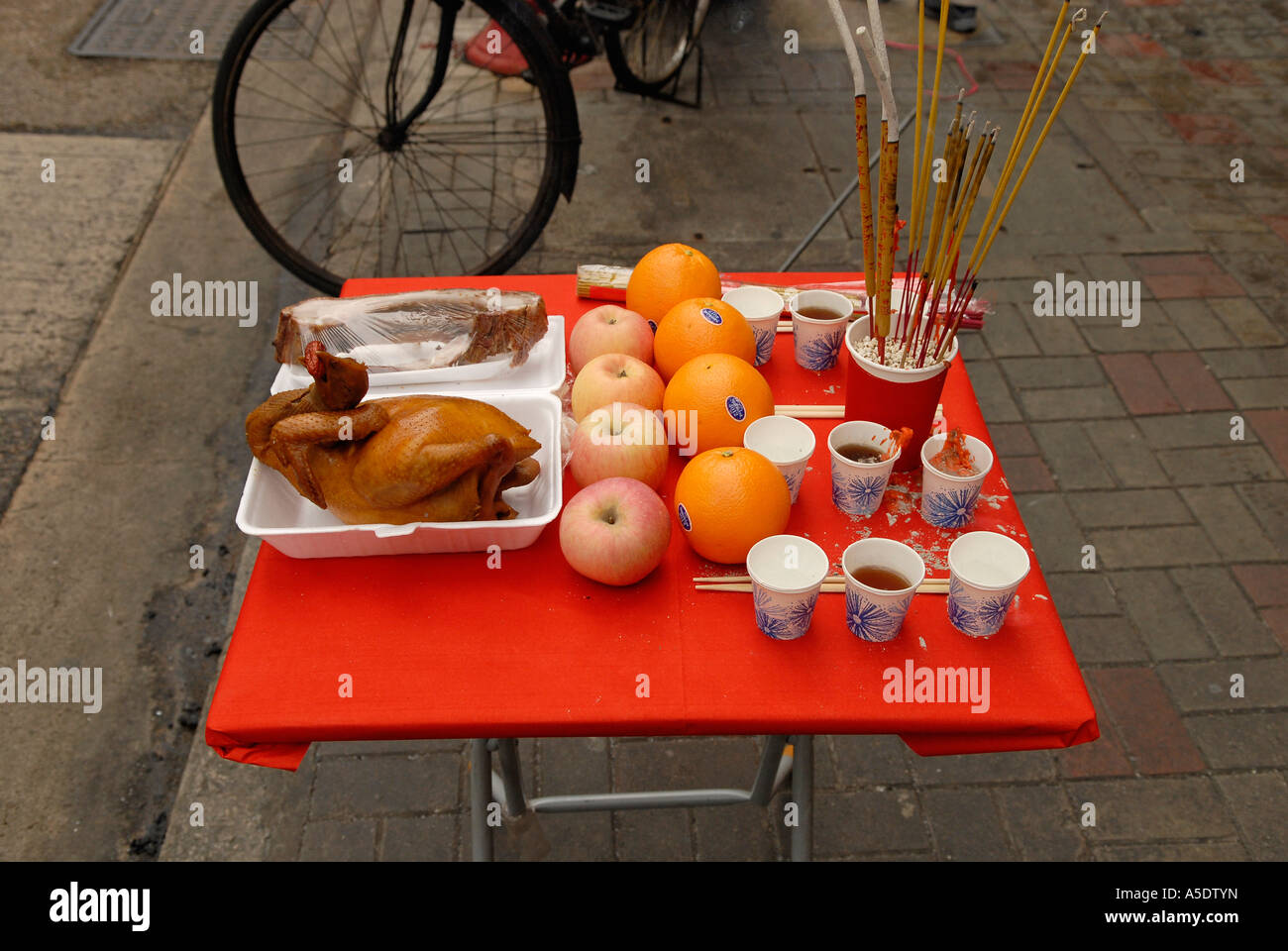 Table set with food and burning incense to wish for good business