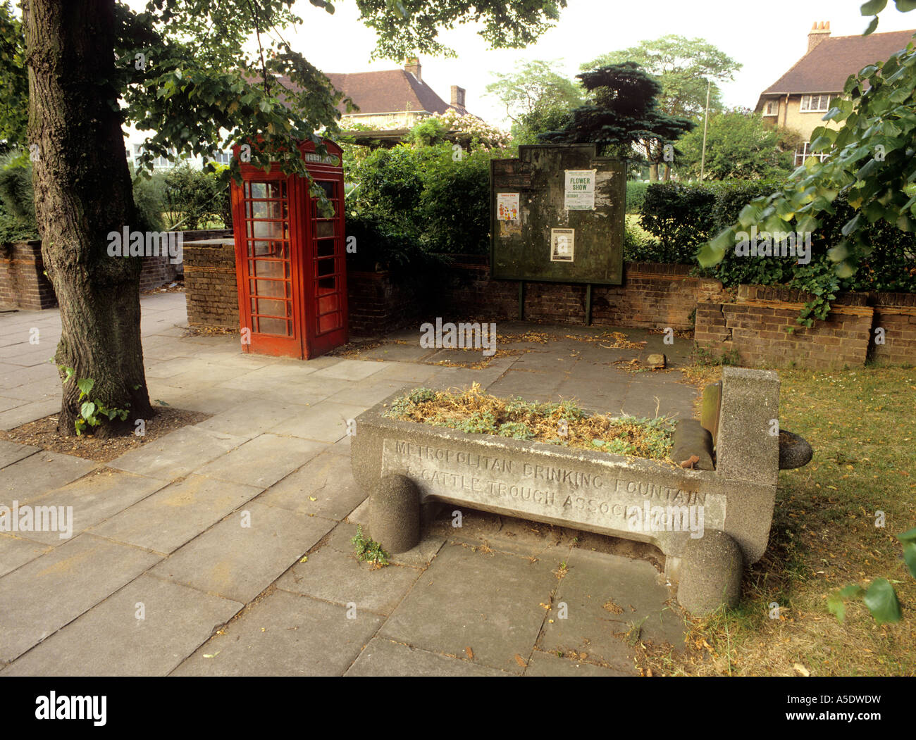Communications London Golders Green K6 phone box outside public garden near horse trough Stock Photo