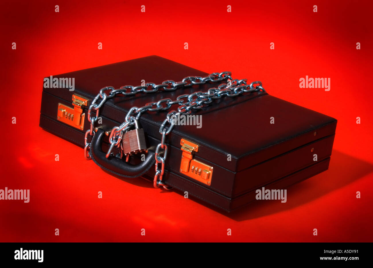 Briefcase in chains Stock Photo Alamy