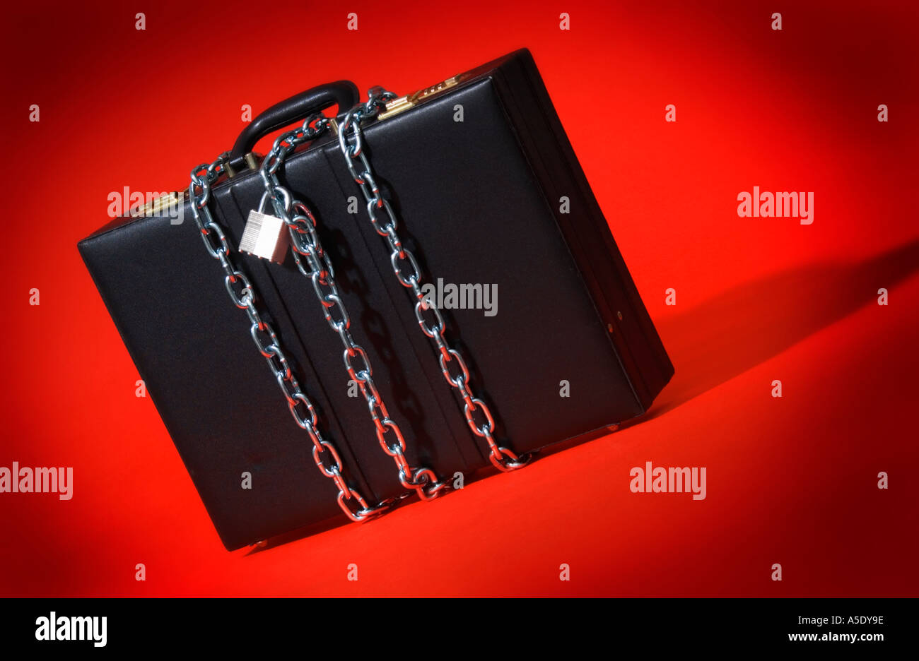 Briefcase in chains Stock Photo Alamy