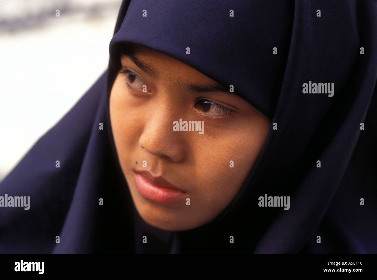 Portrait of young Javanese woman in Muslim dress Yogyakarta Java Indonesia Stock Photo