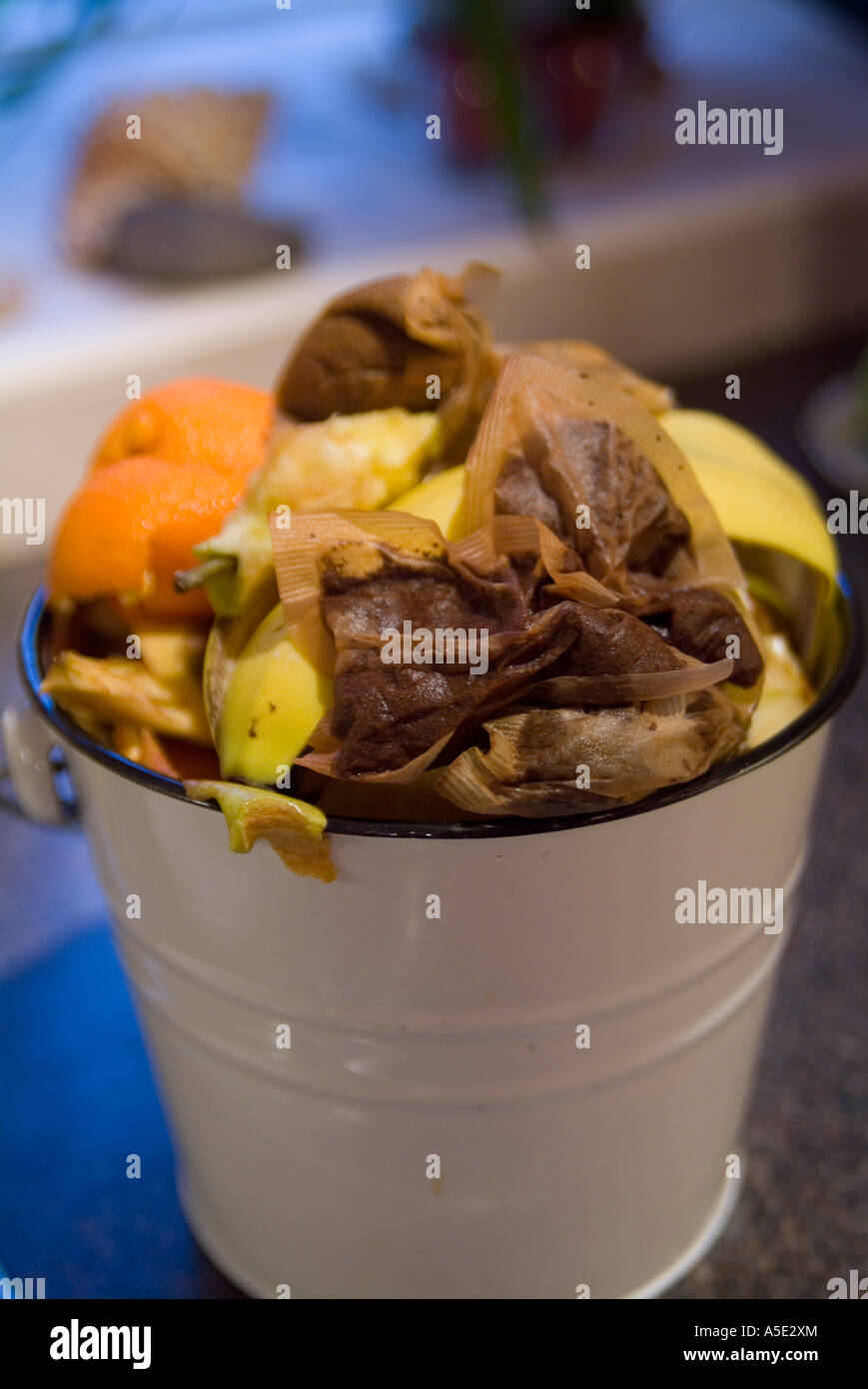 mixed kitchen compost in a cream enamelled bucket portrait Stock Photo ...
