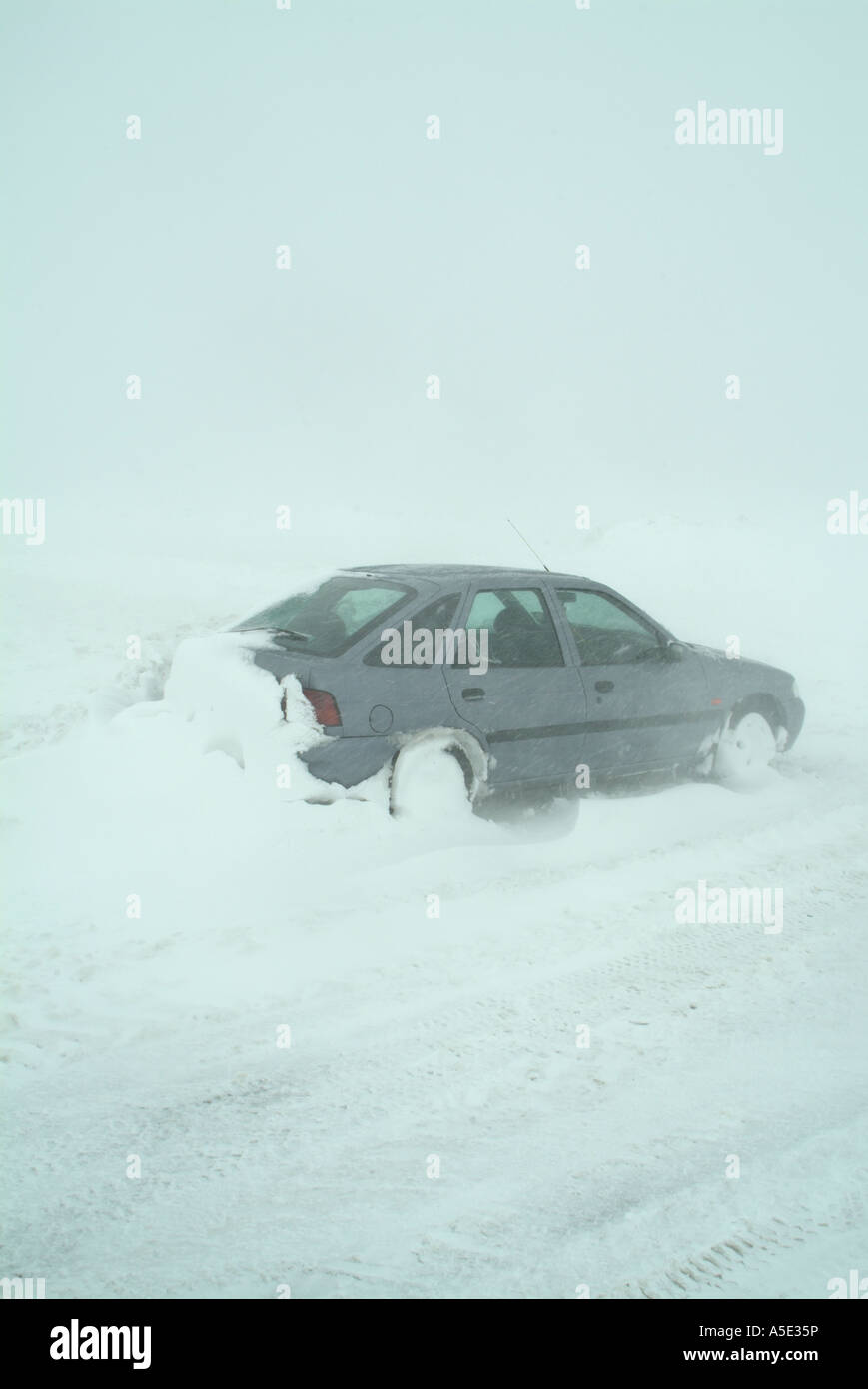 Car stuck in snow during a blizzard on Blakey ridge on the North ...