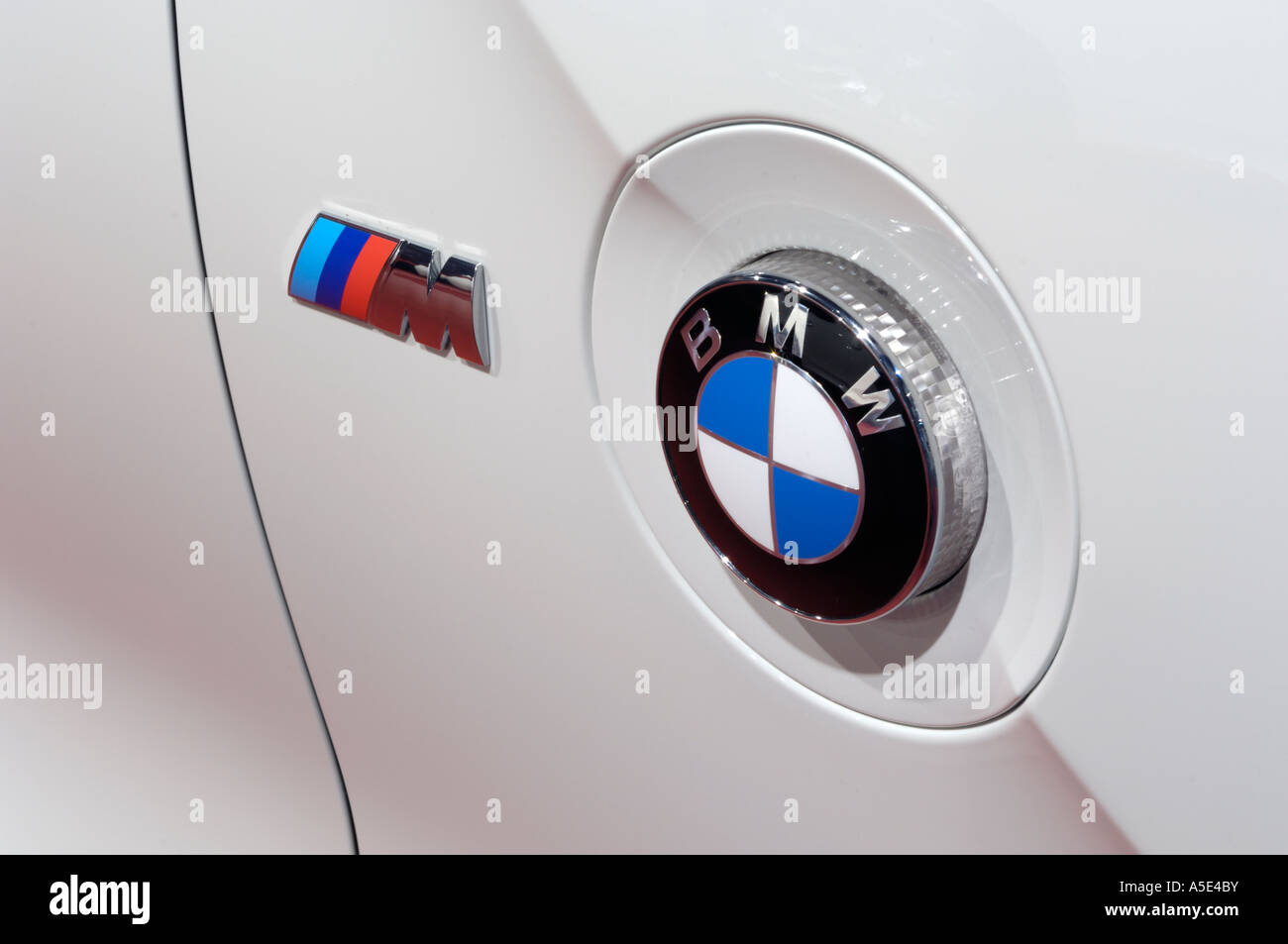 BMW and M emblems on the side of a 2007 BMW Z4 at the 2007 North American International Auto Show Stock Photo