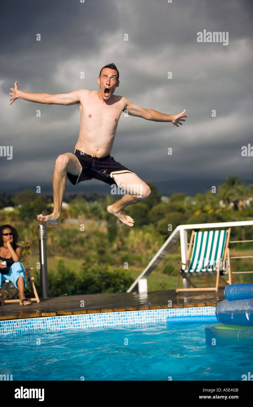 Man Jumping into Swimming Pool Stock Photo Alamy