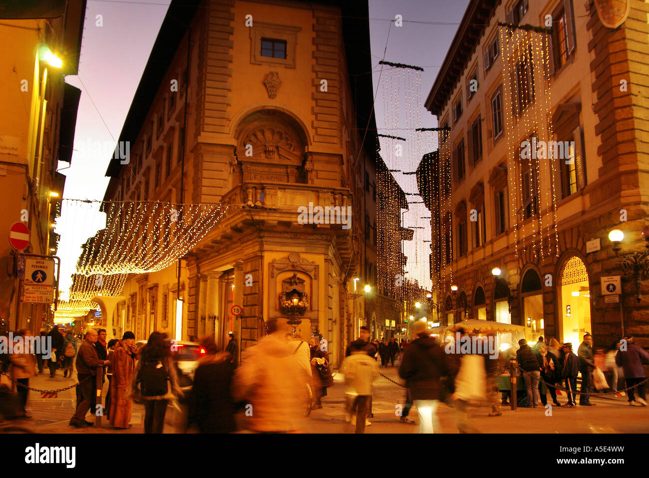 Florence Christmas shoppers hurried night-time Christmas lights and