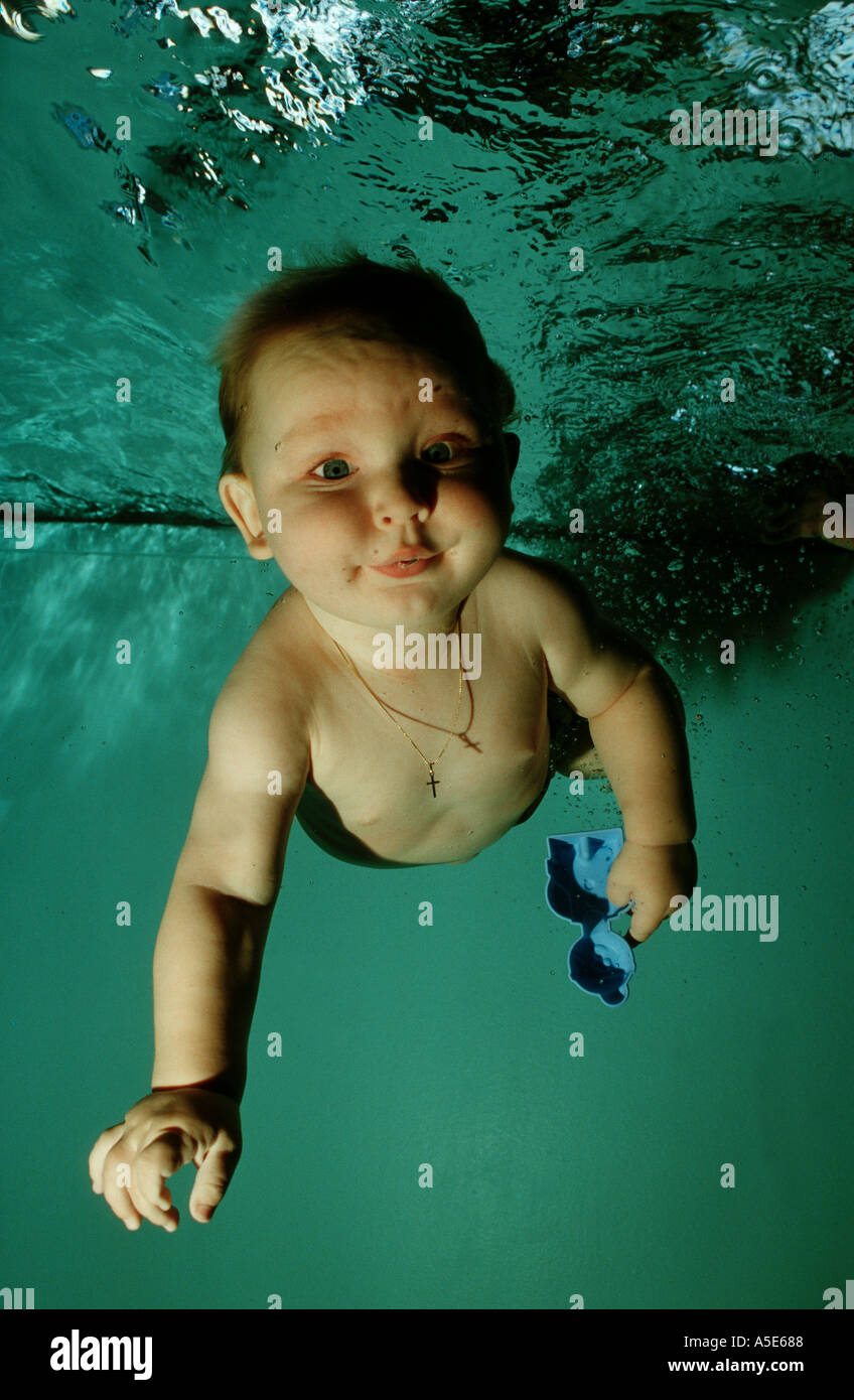 baby diving in pool and having fun underwater Stock Photo Alamy