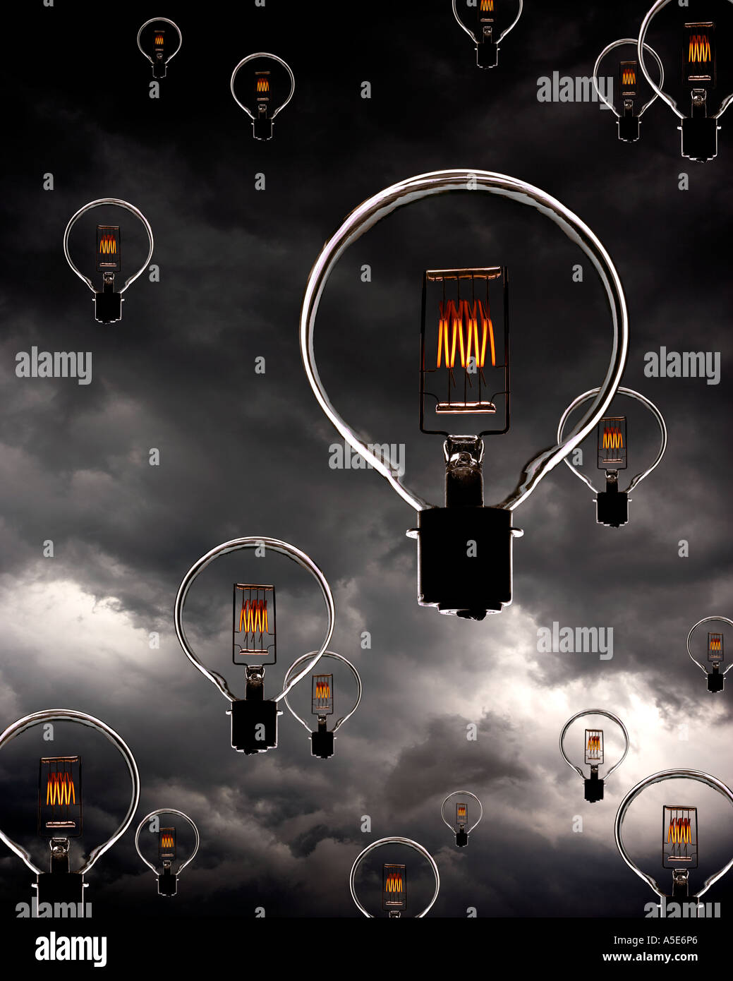 ELECTRIC LIGHT BULBS WITH GLOWING FILAMENTS FLOATING IN SKY WITH STORM