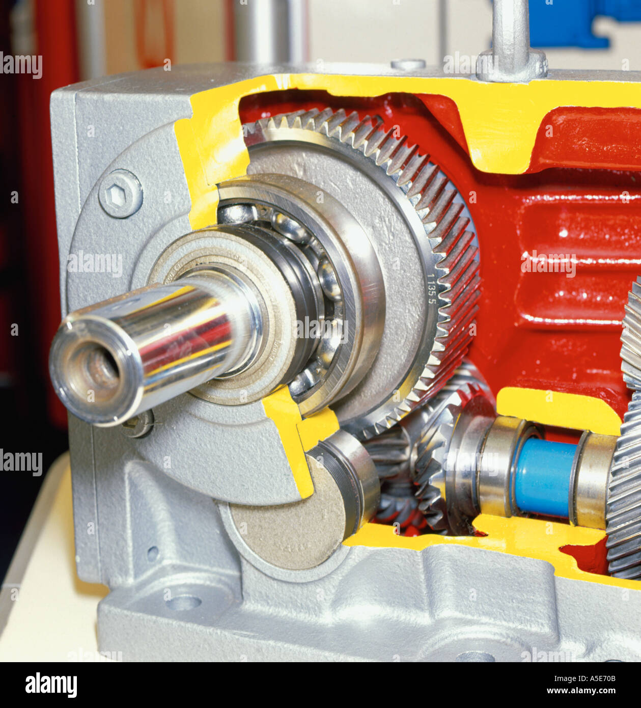 Cut away section through a gearbox showing gears and bearings Stock