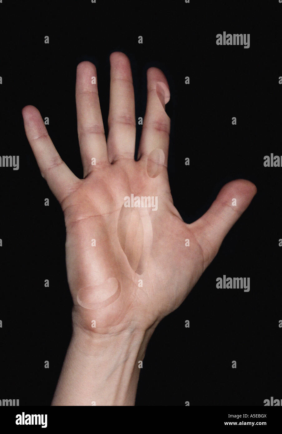 Digitally manipulated photograph of a hand with bits of flesh cut out Stock Photo