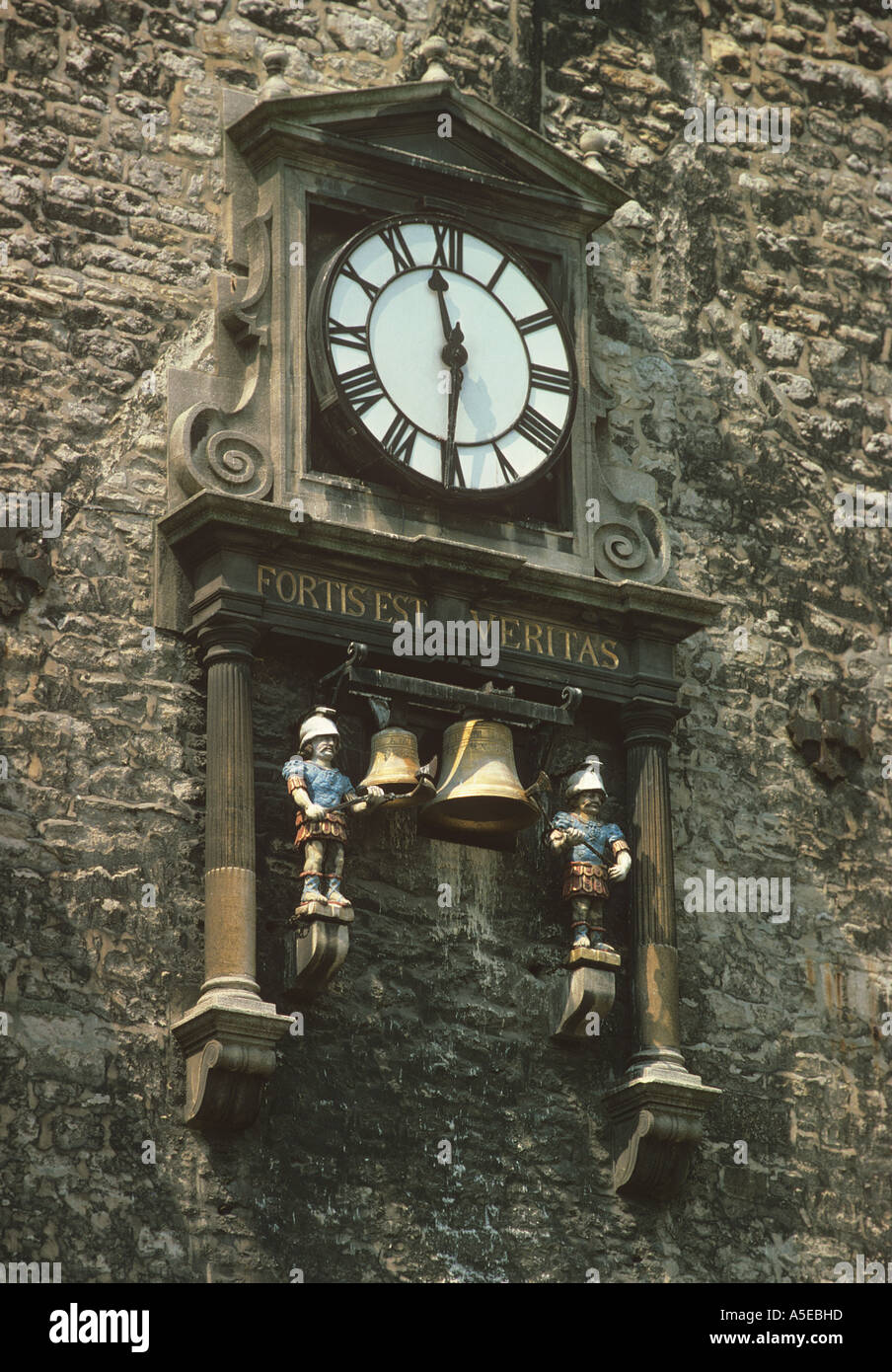Carfax clock overlooks the busy centre of Oxford decorated figures strike the bell to sound the time Stock Photo
