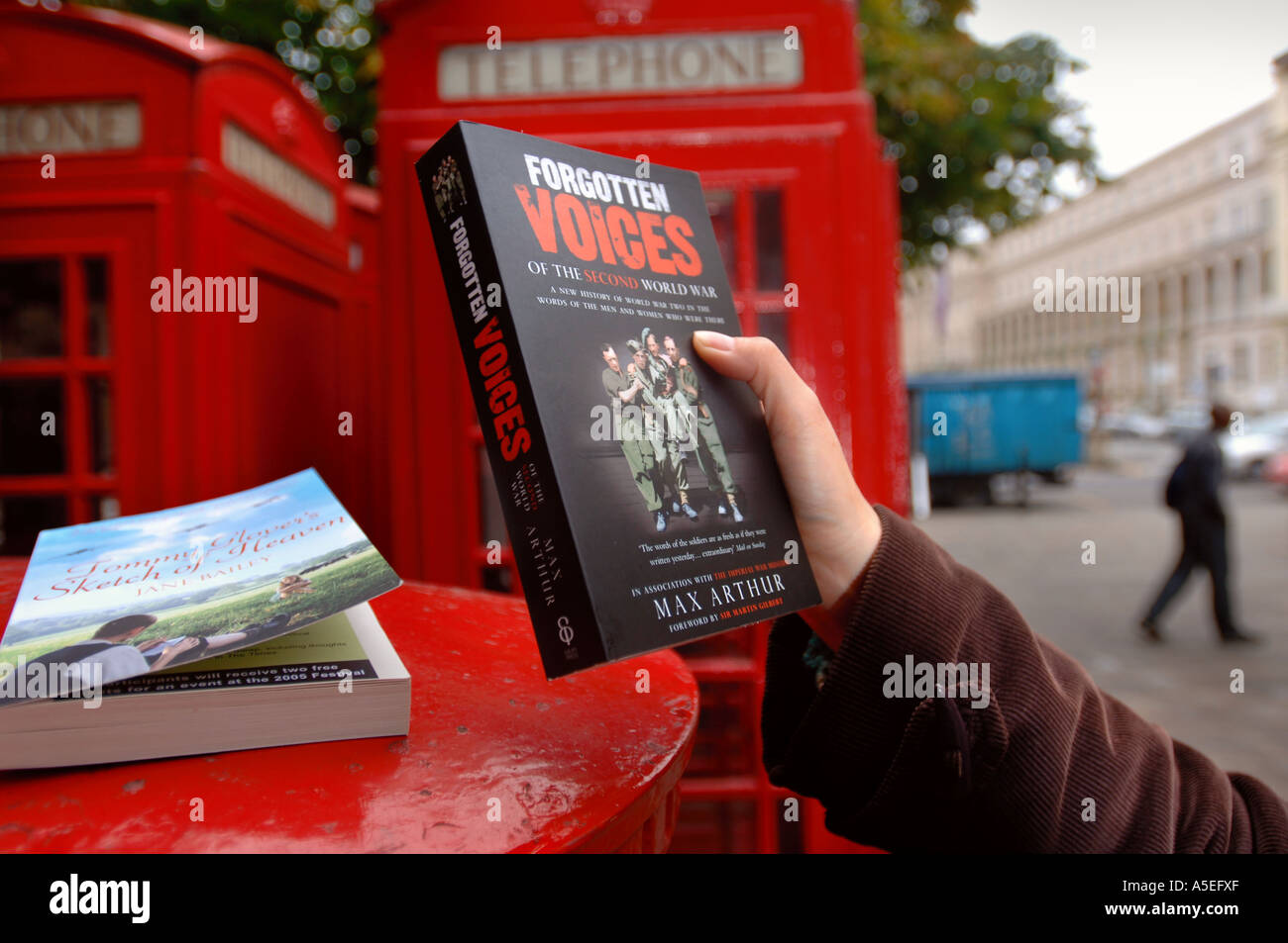 BOOKS LEFT ON A POST BOX AS PART OF THE BOOK DROP SCHEME AT THE CHELTENHAM LITERARY FESTIVAL UK Stock Photo