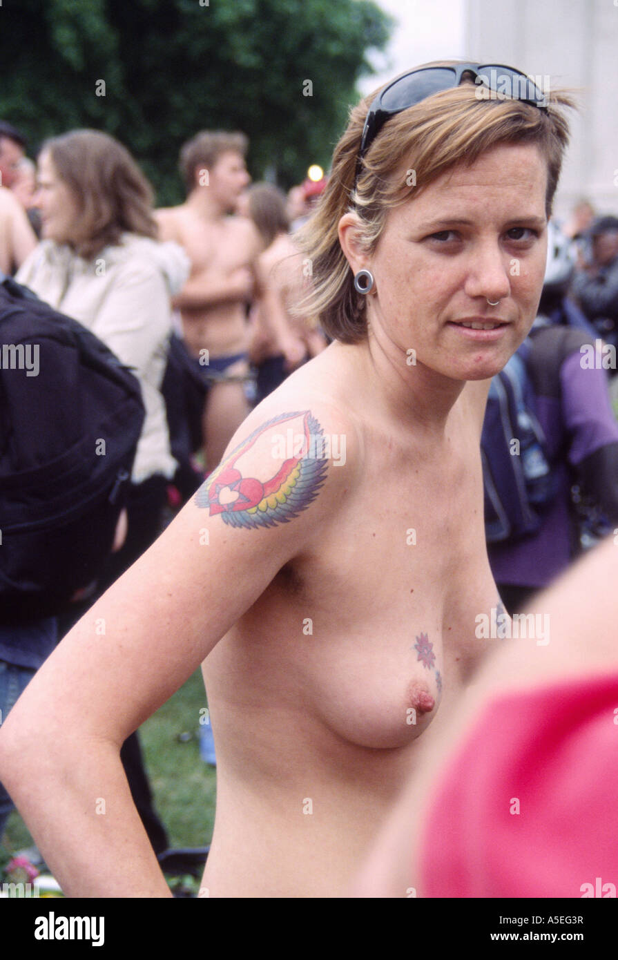 crowd womens naked  London 11 June 2005: A topless woman stands in a in a crowd of naked people  at the World Naked Bike Ride protest, Hyde Park Stock Photo - Alamy